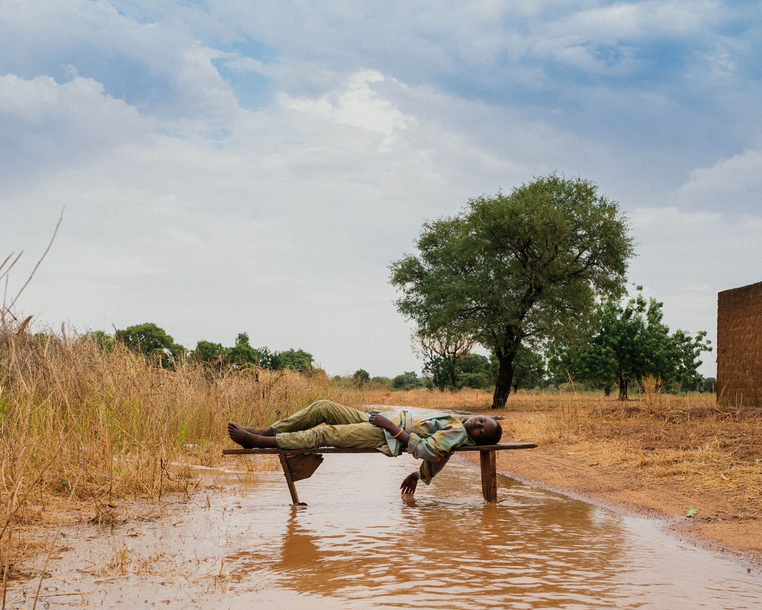 Man laying on a bench