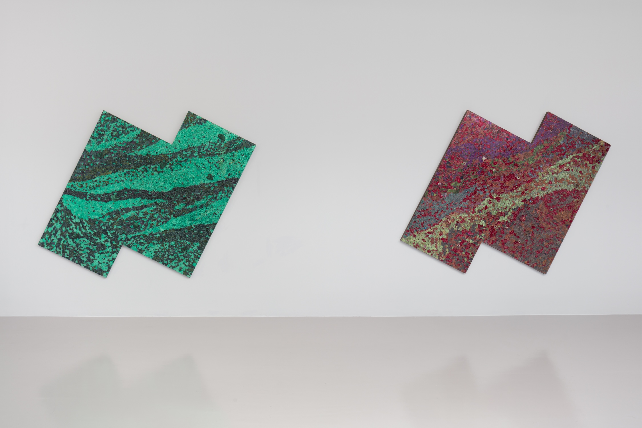 In-situ photograph of person walking past artworks by Alteronce Gumby in Nicola Vassel Gallery.