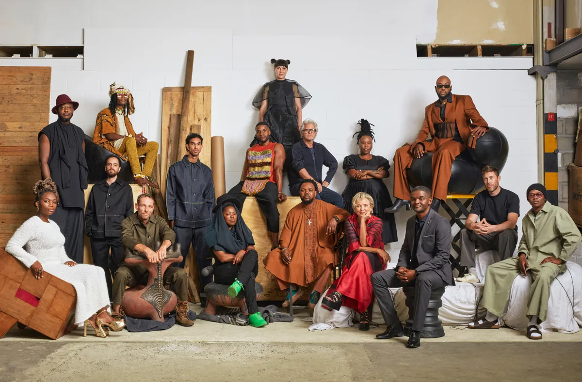 A large group of people posing in the center of a large room
